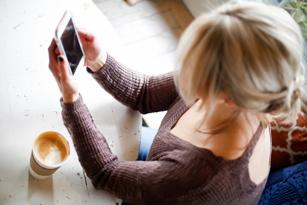 Free woman browsing smartphone photo