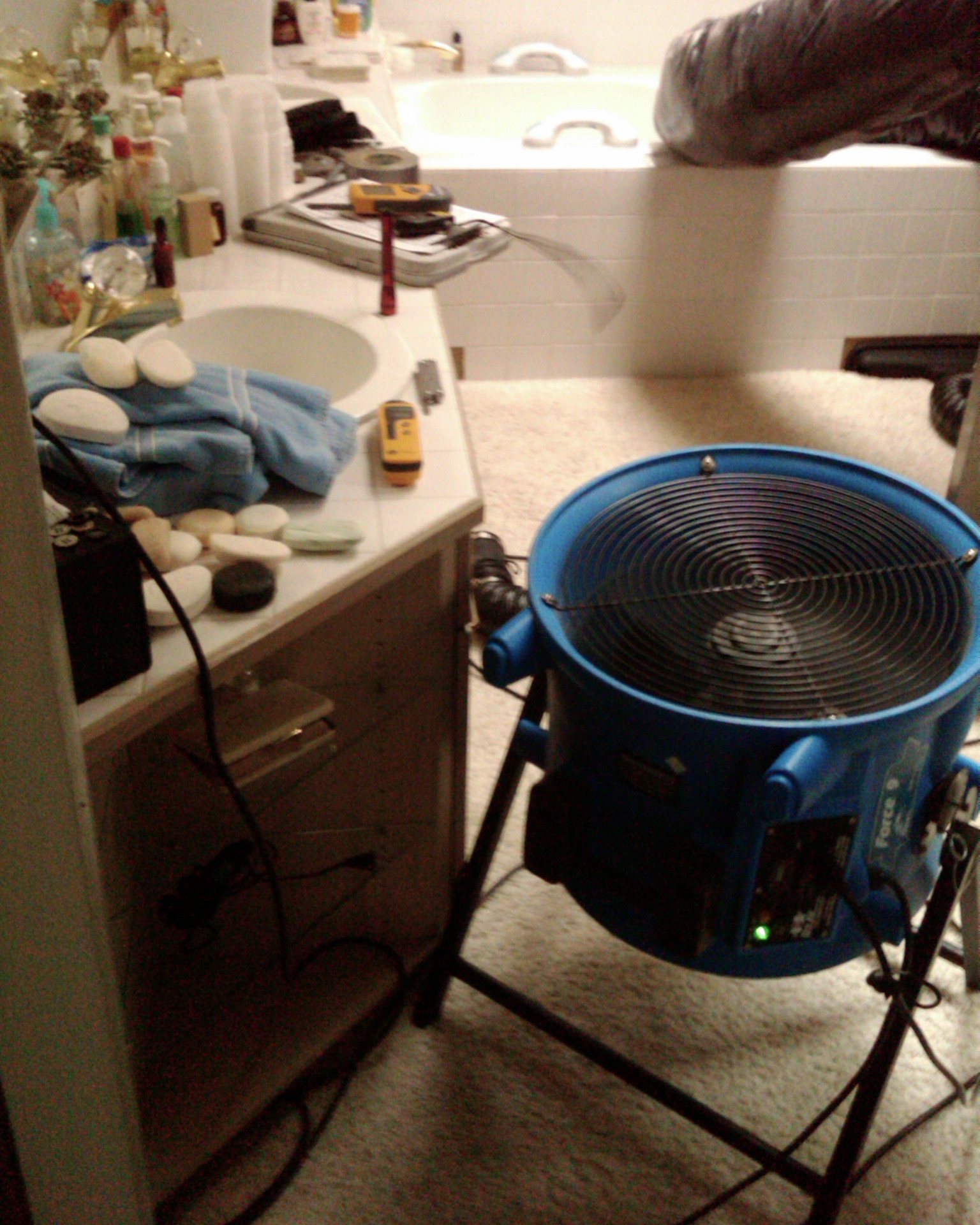 A bathroom in Vancouver WA during a water damage restoration using an Axial Fan