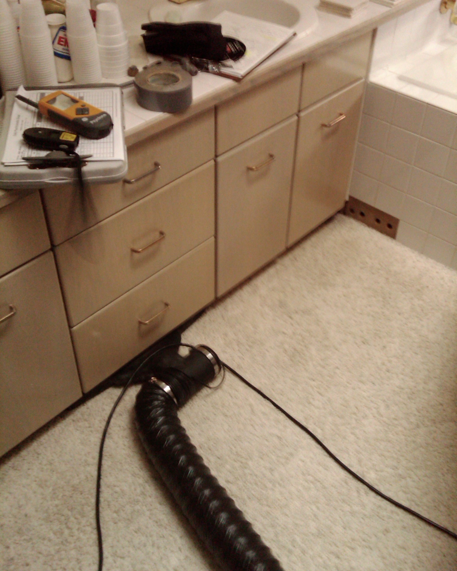 Image of a black wall injection drying system drying under a bathroom cabinet at 3111 Se Balboa Dr Vancouver, WA 98683