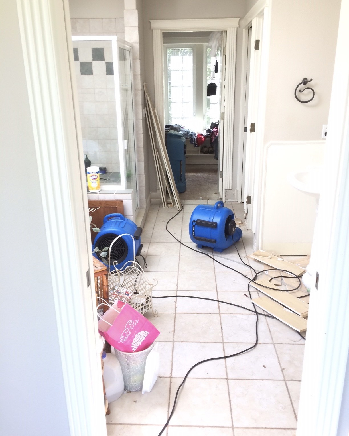 A bathroom of a home at 31213 NE 69th St  Camas, WA 98607 going through the drying process with two blue centrifugal fans.  